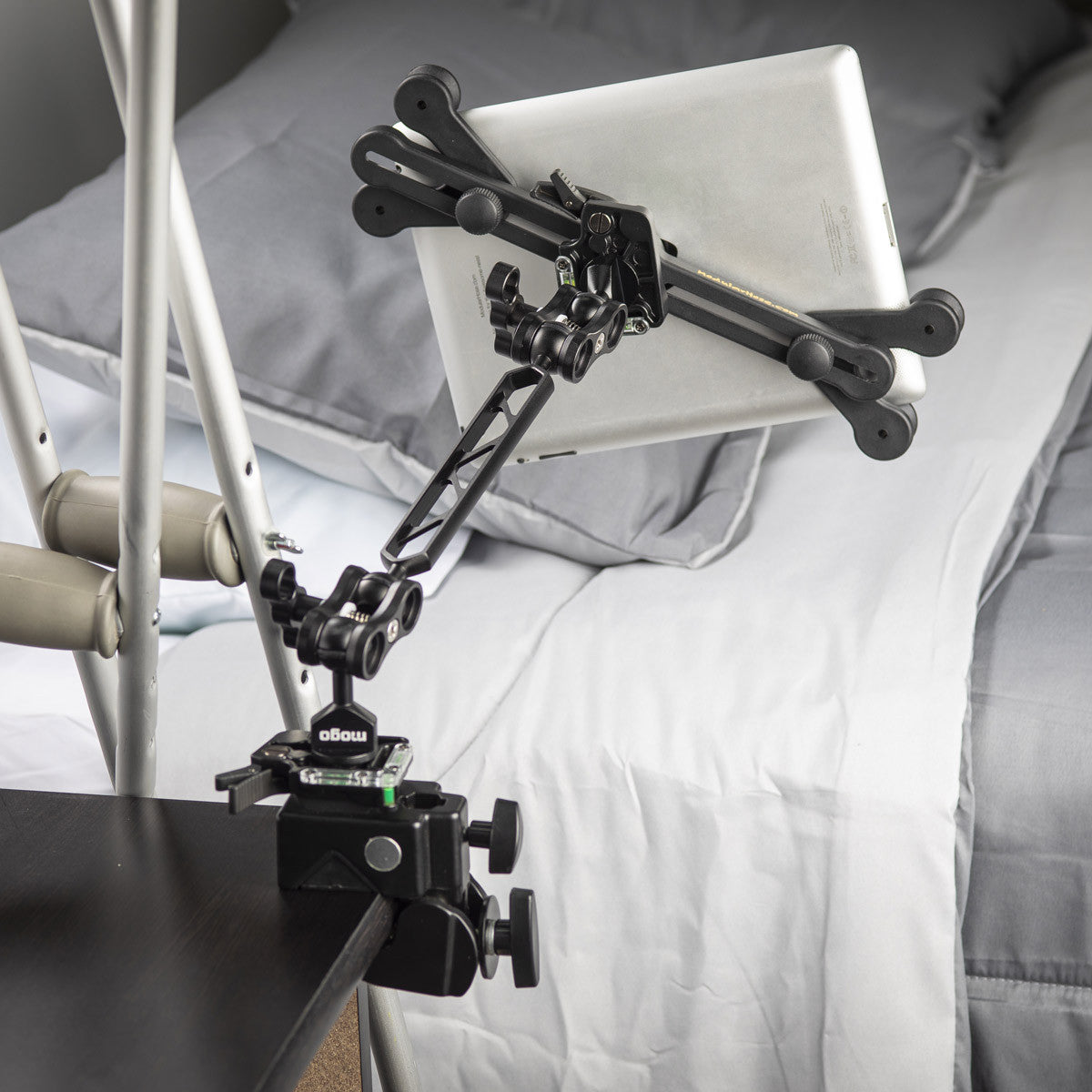 mogo Tablet Holder with QuickClick holding iPad on night stand