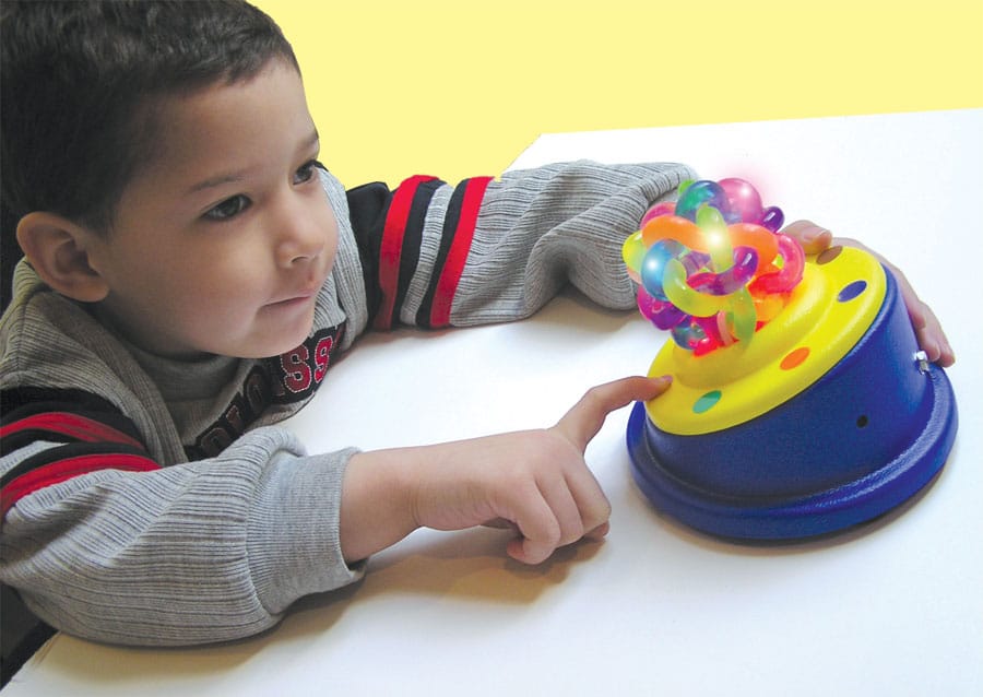Boy Using Textured Orbit Ball Switch