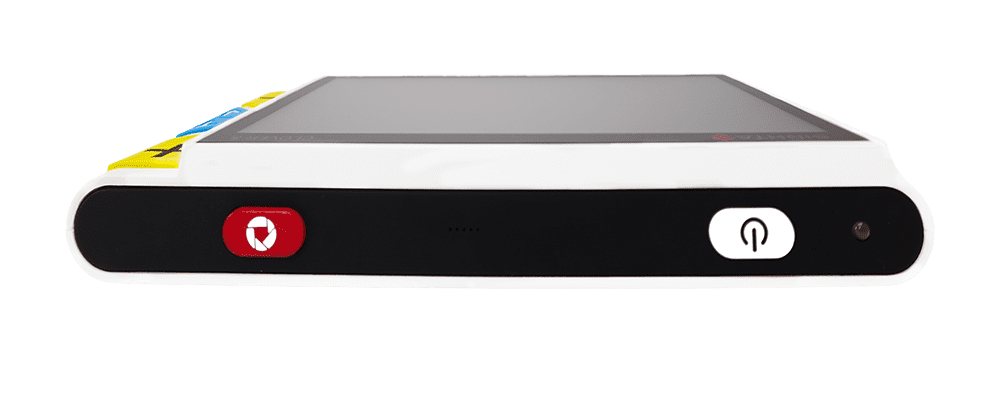 A white and black electronic device with a rectangular screen, featuring a red button with a white heart and a white button with a power symbol on the front, set against a solid green background. Clover 5 Special Needs Computers.