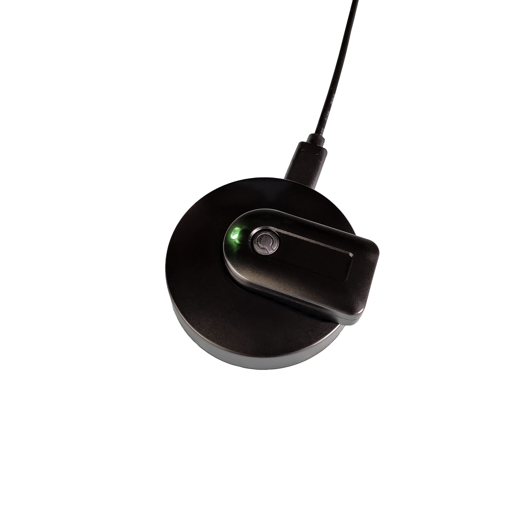 A black circular wireless charging pad with a matching black charging module resting on top, featuring a small green LED indicator light, shown against a solid white background.