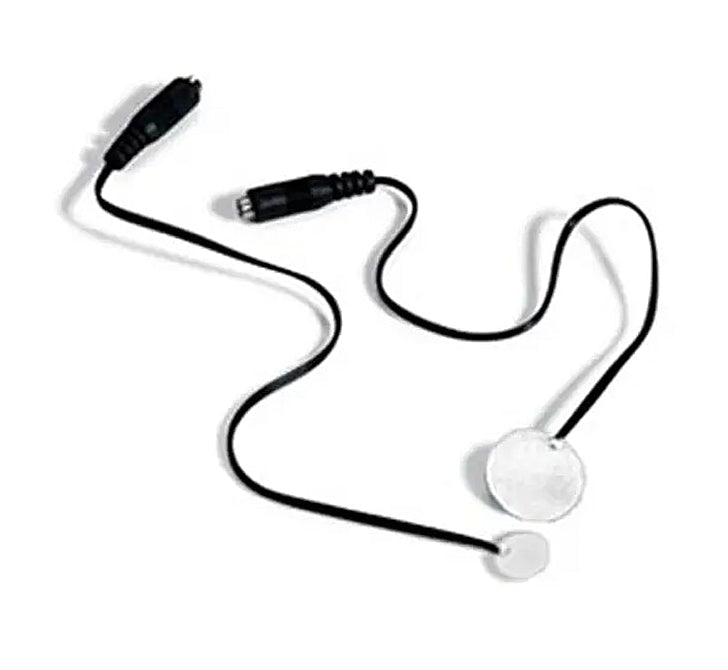 A black wired electronic device with two black connector plugs and two round silver metal pads, shown on a plain white background. Special Needs Computers.