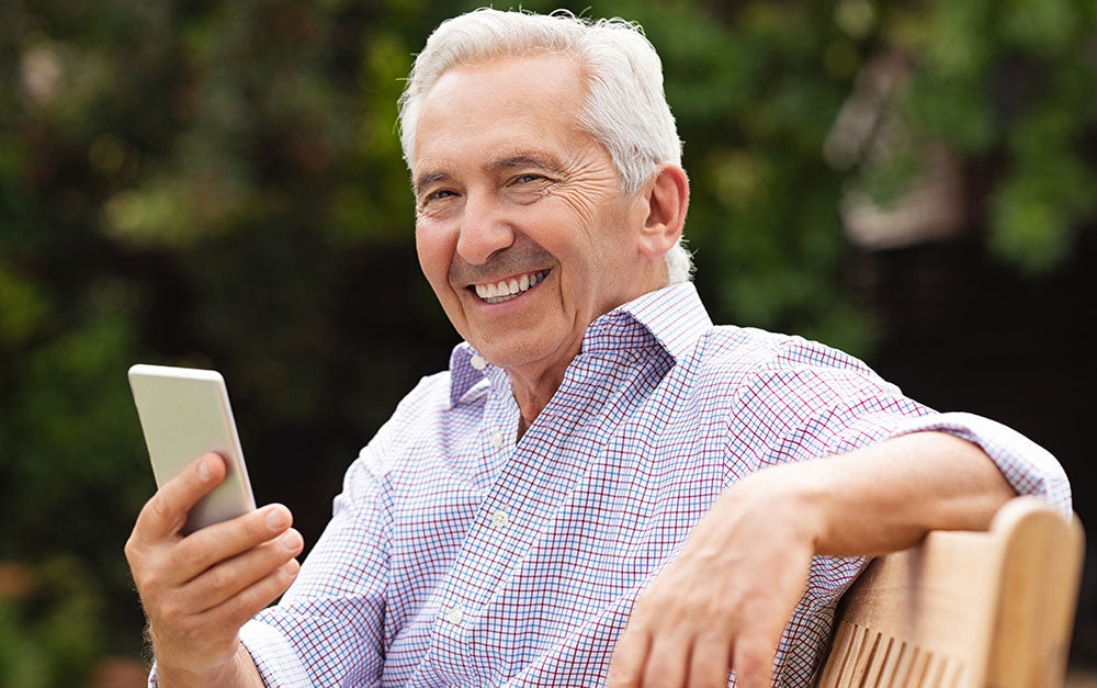 MiniVision2+ Cell Phone man using - 4