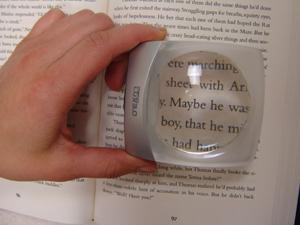 MenasLUX Magnifier Used on Book