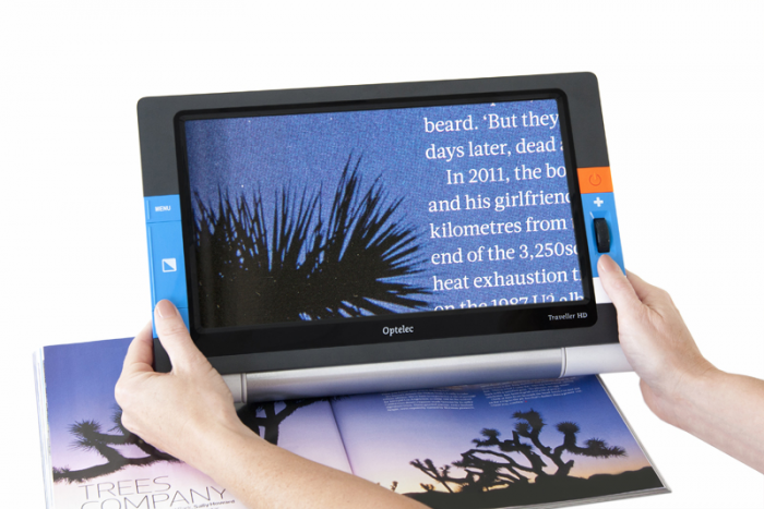 Optelec Traveller HD Portable Video Magnifier on coloured magazine