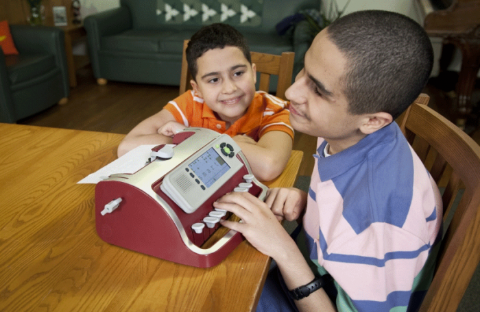 Perkins SMART Brailler boy learning