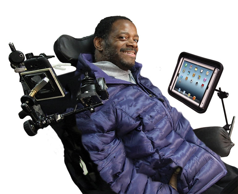 Man Using iPad Mounting System On Wheelchair