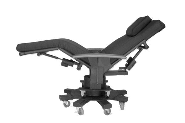 A black adjustable reclining treatment table with a headrest, padded armrests, and a wheeled base, shown on a plain white background.  Zero Gravity Chair 6 - Bariatric.  Special Needs Computers.ca
