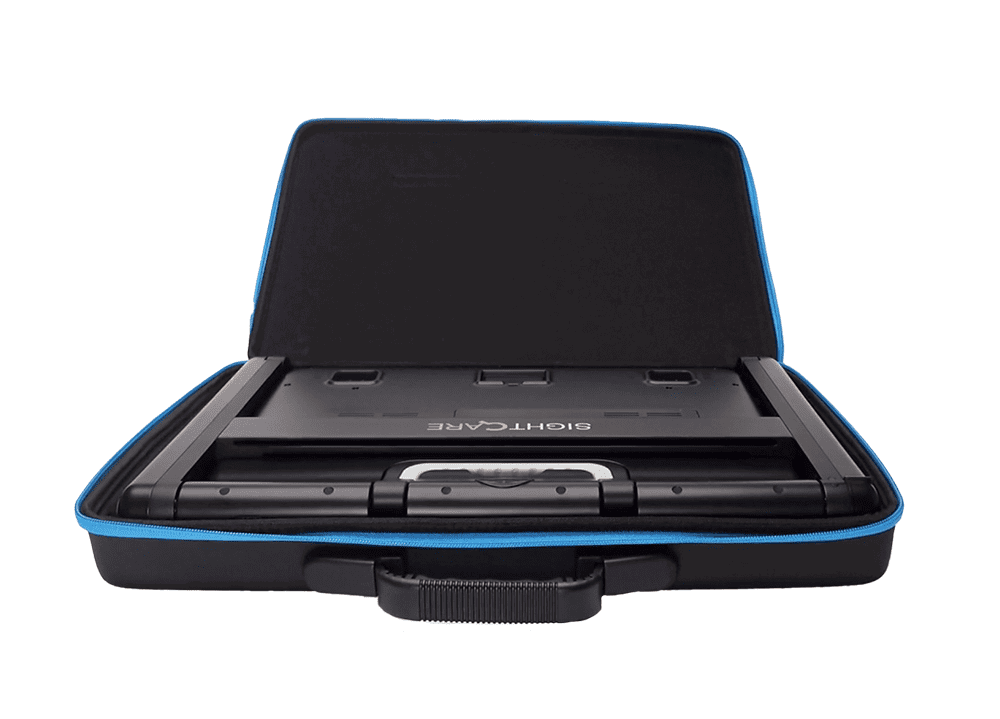 A black hard-shell carrying case with blue trim, shown open with a game controller inside on a plain white background. Special Needs Computers.