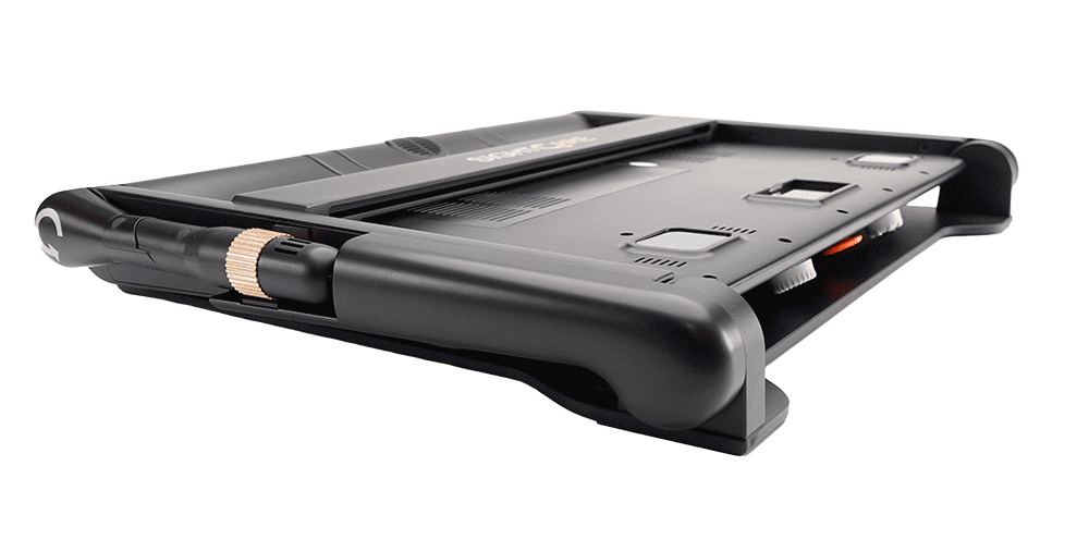 A rugged black protective tablet case shown from an elevated rear angle, featuring a built-in kickstand and a metallic rose gold accent ring on the side, set against a plain white background. CloverBook XL Special Needs Computers in Canada.