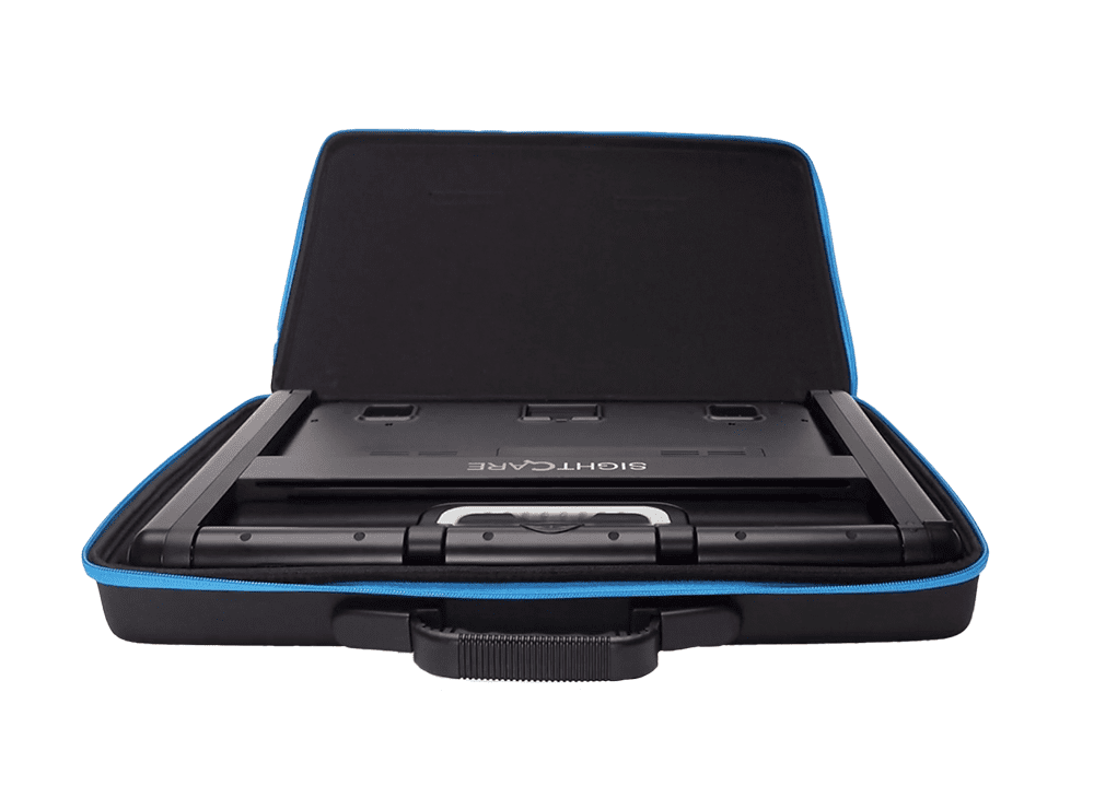 A black hard-shell carrying case with blue trim, shown open with a game controller inside on a plain white background. Special Needs Computers.