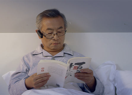 AngelEye Wearable Smart Reader man reading book in bed