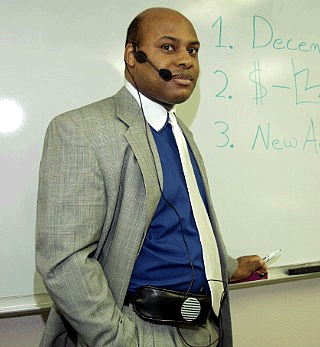 Man Teacher at white board wearing Chattervox